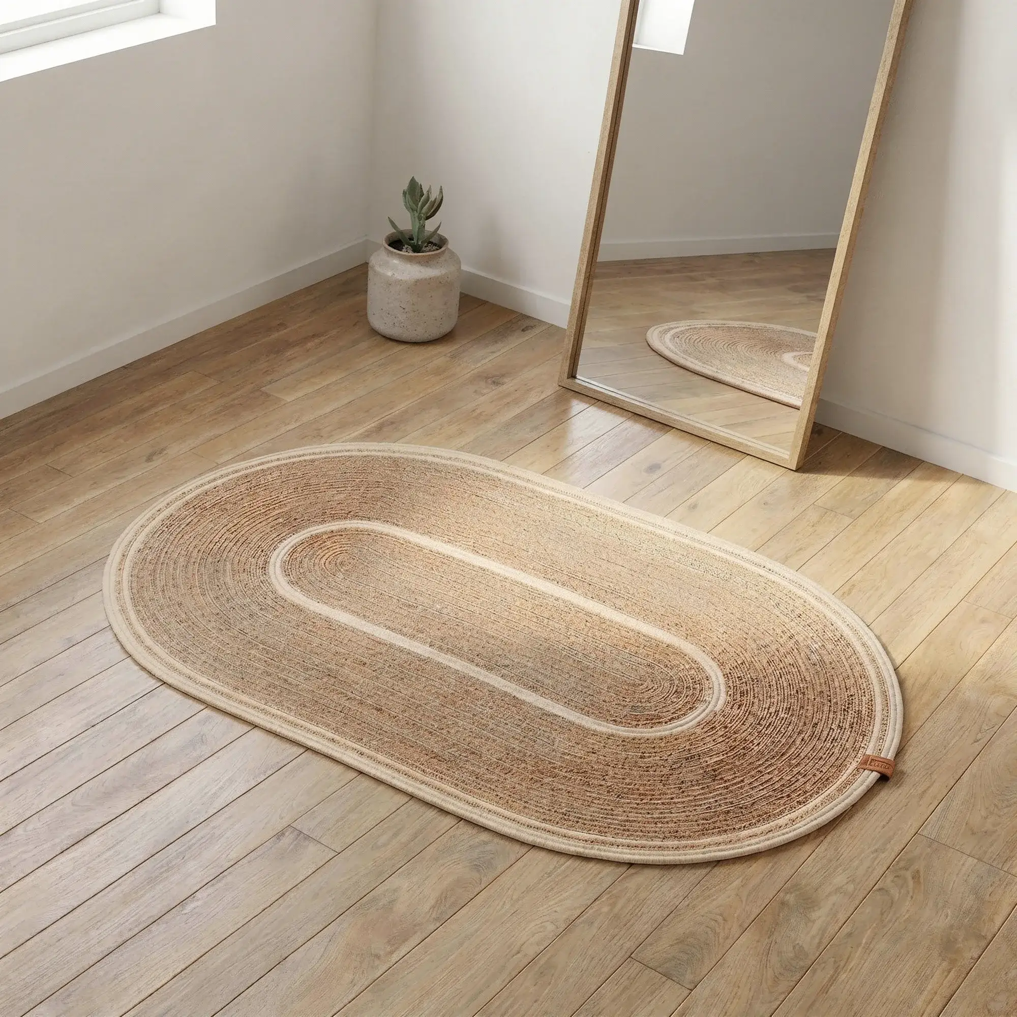 Handcrafted Large Oval Braided Cotton Rug – product and lifestyle view 6