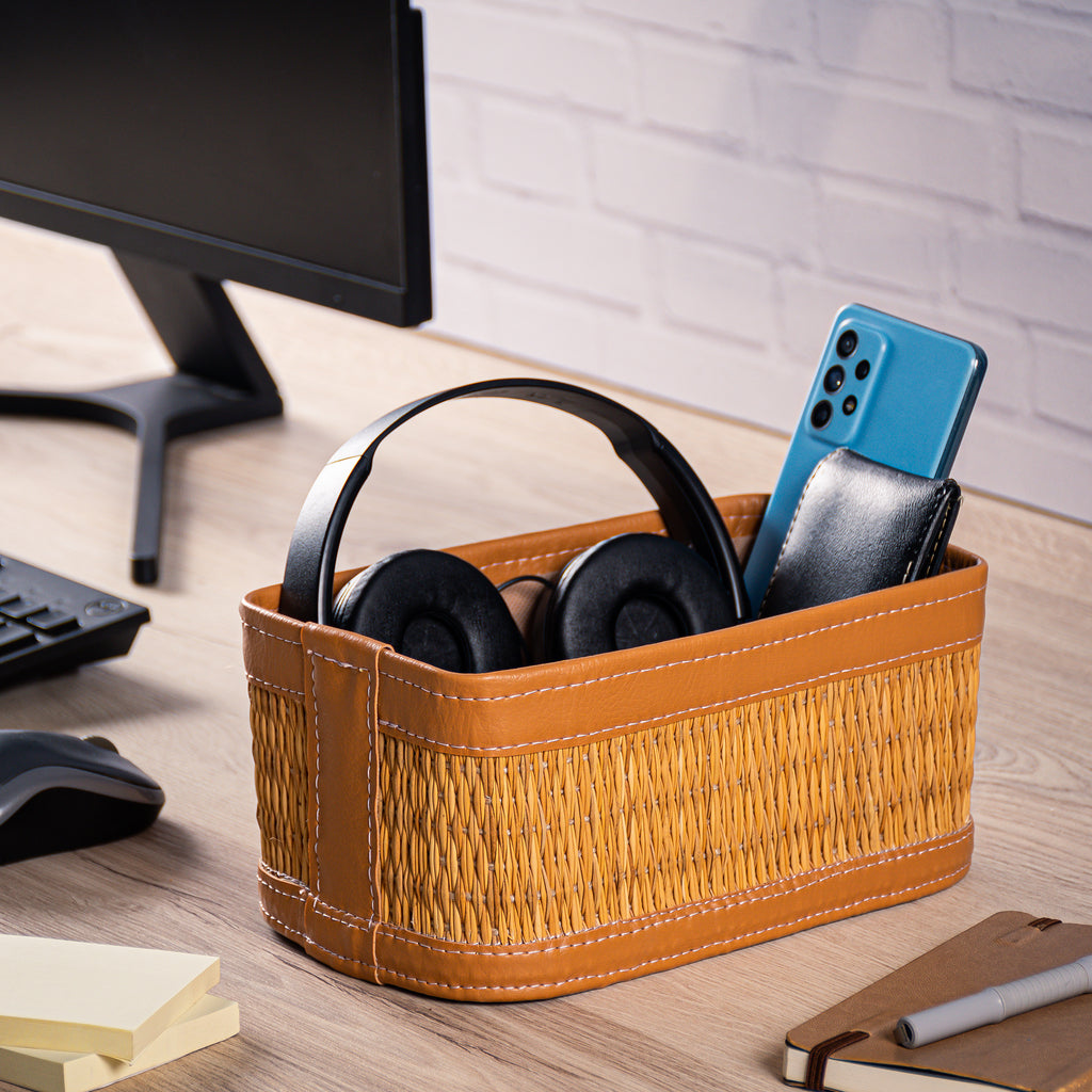 Brown darido natural fiber storage box with colored leather trim holding headphones and phone. - Set of 3 Handmade Natural Fiber Storage Boxes with Colored Leather Trim