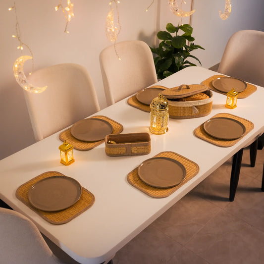 Sahara woven placemats and baskets arranged on a dining table