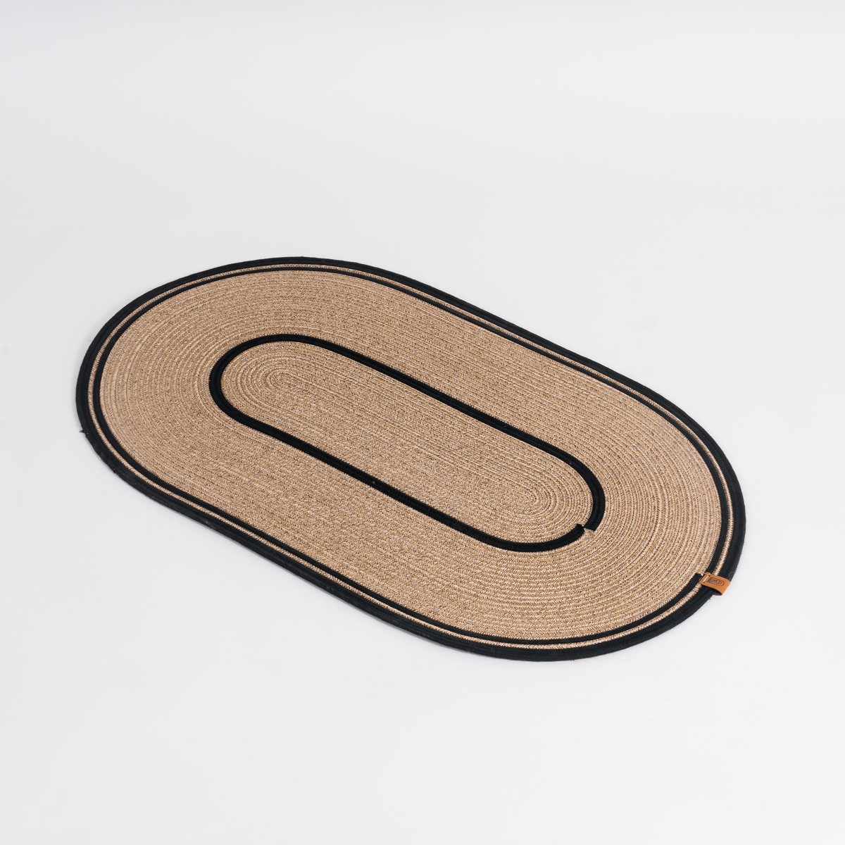 Handcrafted Large Oval Braided Cotton Rug – product and lifestyle view 7