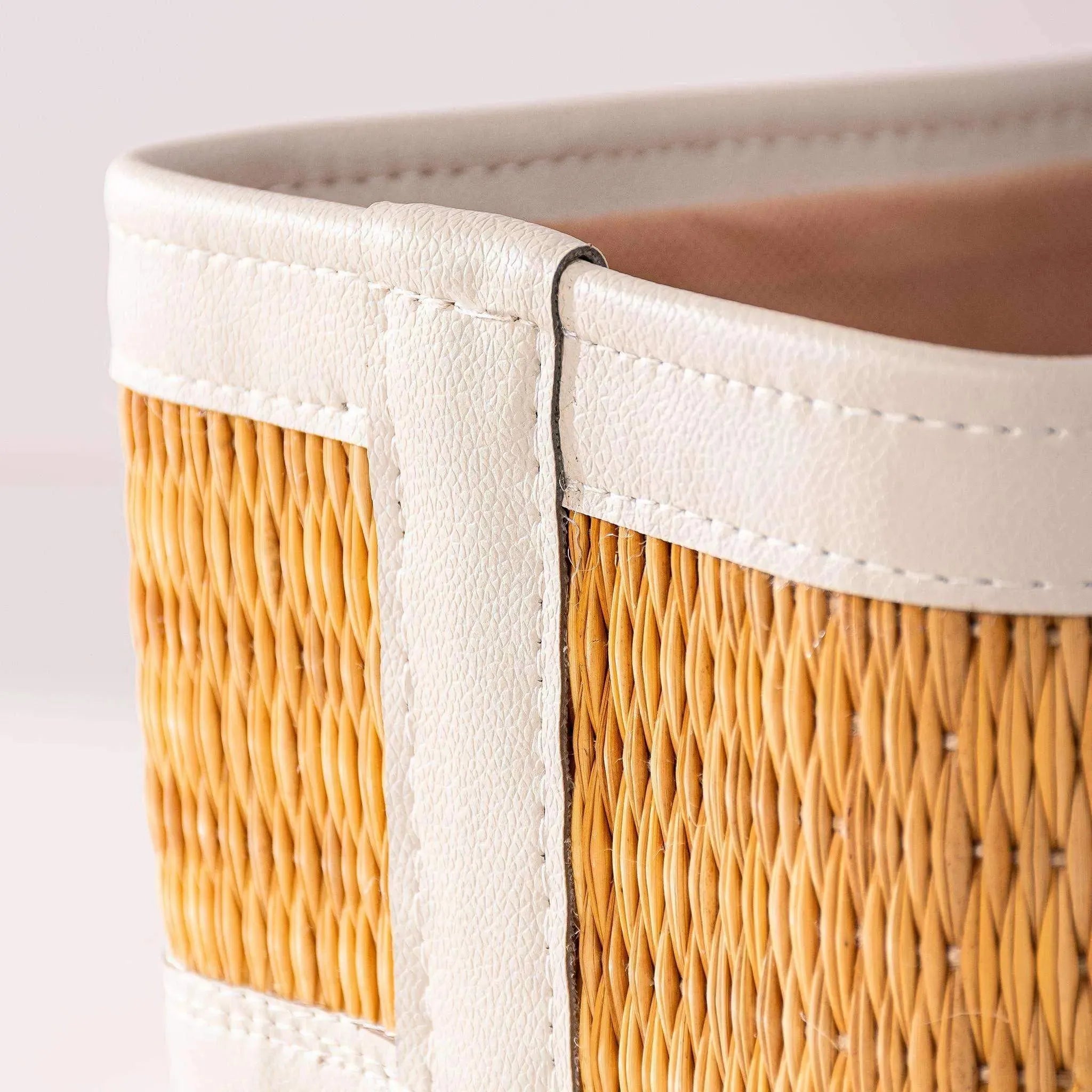 Medium-sized darido storage box with woven rattan body and white fabric trim. - Medium-Sized Storage Box | 27x17 cm