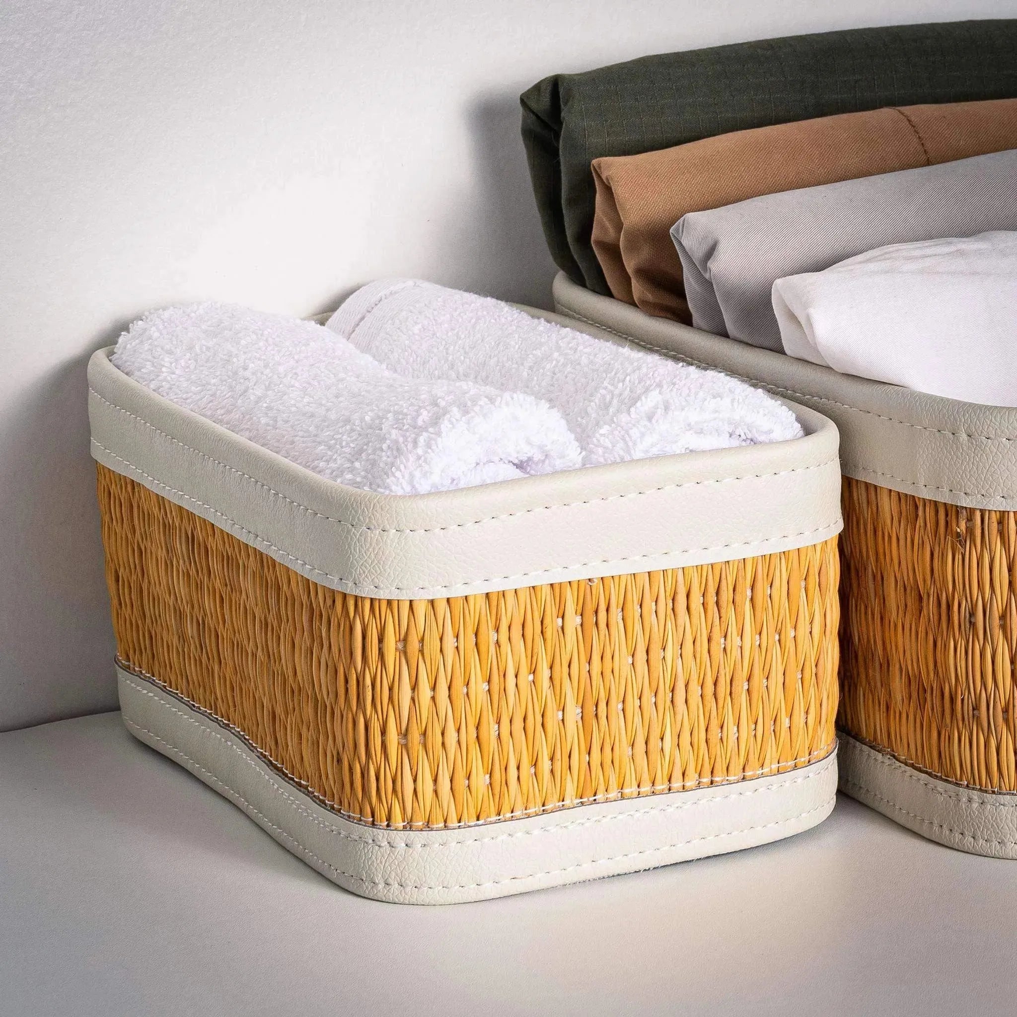 Darido small rectangular woven basket with white fabric lining and trim, holding rolled towels. - Small Storage Box | 22x13cm