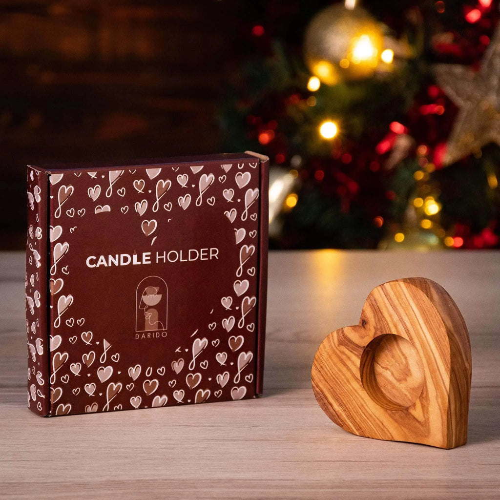 Heart-shaped olive wood tealight holder with darido logo beside brown box decorated with hearts. - Olive Wood Tealight Holder - Heart Shape - 10x10x2 cm