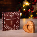 Heart-shaped olive wood tealight holder with darido logo beside brown box decorated with hearts. - Olive Wood Tealight Holder - Heart Shape - 10x10x2 cm