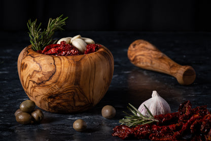 DARIDO Authentic Tunisian olive wood round mortar and pestle, ideal for grinding, with ergonomic design.