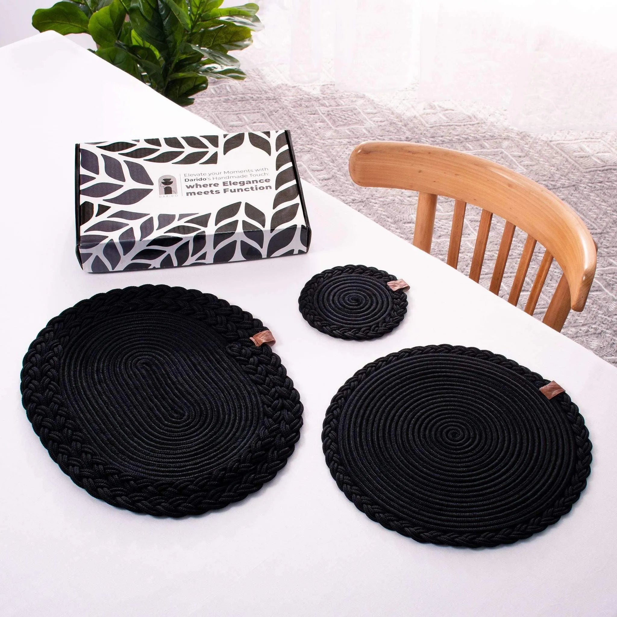 Set of 2 black darido cotton coasters, round braided design, 15cm diameter, with matching smaller coaster and branded tags. - Set of 2 Black Coasters- 15cm